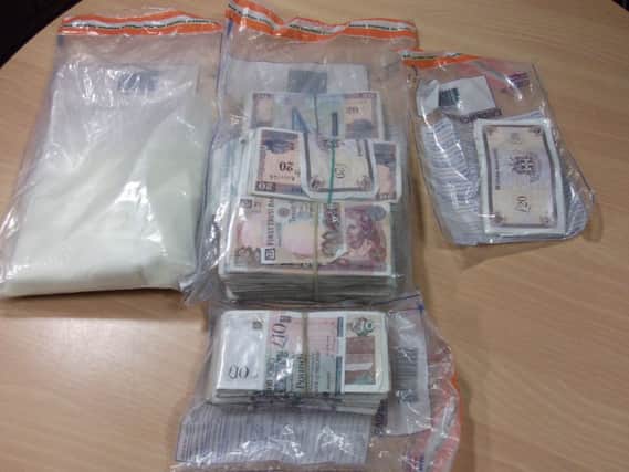 Suspected Class A drugs and a large sum of cash were seized at the property in Carnreagh Bend.