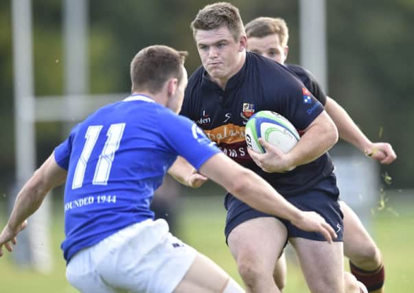 Banbridge's Peter Cromie gets past Thomond's Eamon Chasser during Saturday's Ulster Bank senior league game at Rifle Park. Picture by Angus Bicker/ Presseye.com