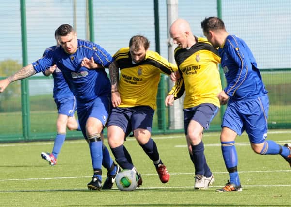 Cookstown RBL and Desertmartin Swifts battle for the ball in the middle of the park during Saturday's league encounter at MUSA.INMM4114-375