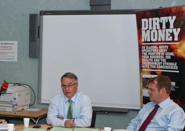 Former Environment Minister Alex Attwood revealing the level extent of illegal dumping in Londonderry in June 2013.