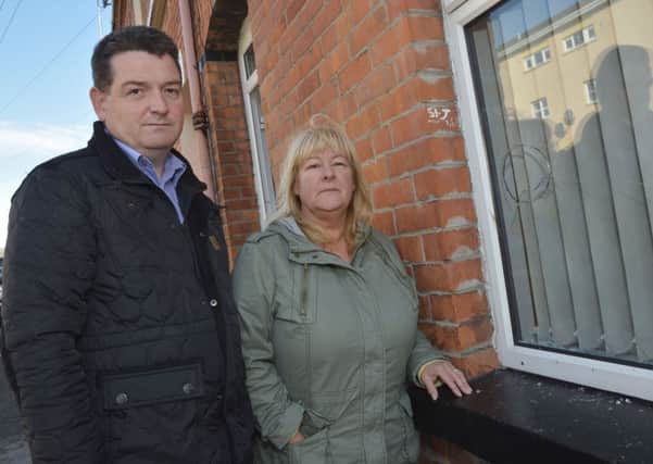 Councillor David Ramsay pictured with Valerie Moore, whose home was attacked. INLS4014-187KM