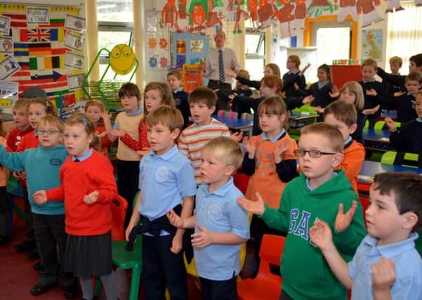 Kilcoan Primary School pupils singing their favourite song 'Every move I make' for the visit of the Presbyterian Church moderator Rev Dr Michael Barry. INLT 41-153-GR