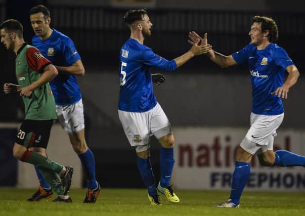 Conor Dillon celebrates his goal - the only bright note for Glenavon on a dismal night.