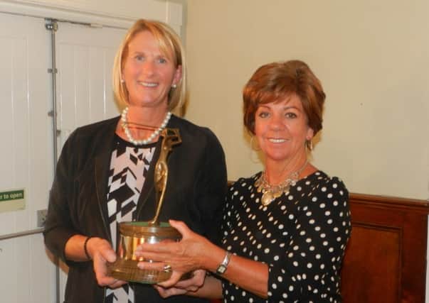 Caroline Speers, the club's current Lady Captain on the left, receiving the Player of the Year award from Mrs Noreen Ritchie, the current Vice Captain, at Galgorm Castle Golf Club ladies' section prize night.