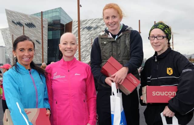 Runher Titanic 10k winners L to R: 3rd - Cathy McCourt, 1st - Heather Foley and 2nd - Louise Smith with Diane McCaughan (second from left) who presented the prizes.