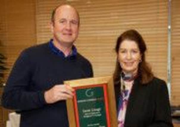 Derek Creagh (left) accepting his award from Georgina Campbell at the Georgina Campbell Awards 2015 at the Bord Bia Head Office in Dublin.