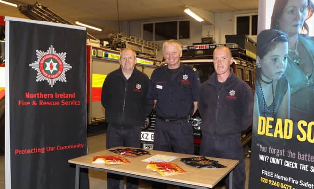 Bennie Elliott, Hugh McGill, Watch Commander and Ciaran Haughey at Ballycastle fire station during open week. INBM42-14