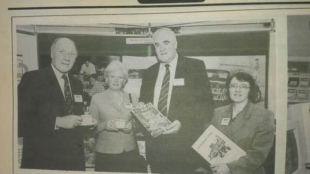 Pictured with managing director David McIlhaggar during Kilroot power station's open day in autumn 1997 are Stephen Hilditch of Belfast High School, Mary Sinnamon of Downshire School and Anna Harper of Carrick College. INCT 41-706-CON HIST