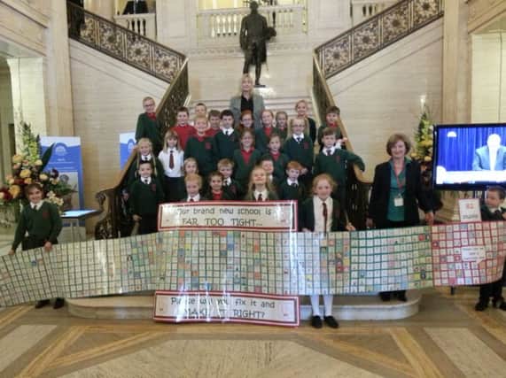 Dromrore Central Primary School principal Linda Allen and pupils in the great hall at Stormont with Lagan Valley MLA Brenda Hale.