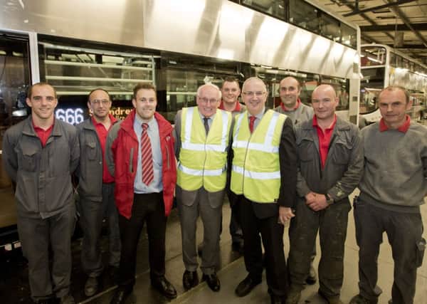 Transport Minister Danny Kennedy  visited Wrightbus in Ballymena where he was given a tour of the production facility and met management and the employees. The minister is pictured with Brian Montgomey, Business Unit Manager, Dr William Wright CBE and Wrightbus employees Chris Richmond, Edwin McKee, Mervin Campbell, Derek McCurry, Gary Richardson and David Morrow.  The Minister said investment in new buses has helped to secure employment and contribute to the local economy.