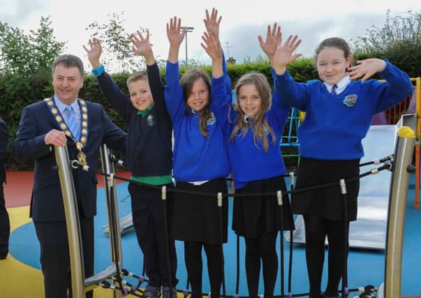 Joining in the fun, Cookstown Council chairman Wilbert Buchanan with some of the pupils from local schools enjoying the new  refurbished play park at Fairhill Cookstown.