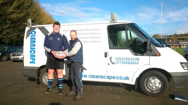 Conor McClean owner of Cleanscape presenting a match ball to U18 player Matthew Mcconaghy before kick-off against Lisburn. INBM42-14S