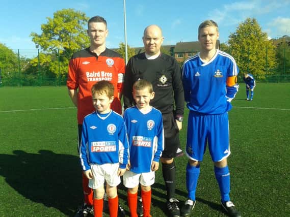 Under 7s mascots William Magill and Max Steenson at Saturdays game along with Banbridge Rangers captain Colin Cousins, referee Paul Caldwell and Ballymacash Rangers captain Andy Patterson.