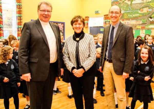 Rev Dr Michael Barry, Moderator of the Presbyterian Church, Mrs Esther Barry and Rev James Rogers of Ballynure Presbyterian Church enjoying their visit to Ballynure Primary School. INNT 42 501-SO