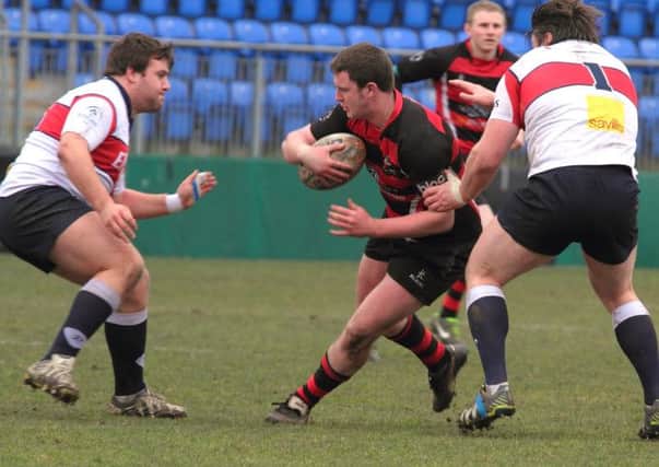 Wing forward Heaney attacks the Old Wesley defence. PICTURE : Charles Henderson.