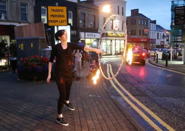 Tribal Fire perform for shoppers at last week's 'Shutters Up' event in Ballymena town centre. INBT 41-102JC