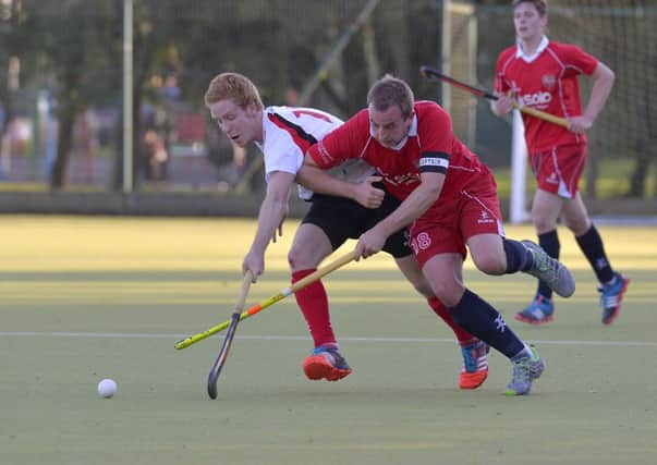 Mandatory Credit: Rowland White / PressEye
Men's Hockey: Irish Hockey League
Teams: Annadale (white) v Cookstown (red)
Venue: Lough Moss
Date: 11th October 2014
Caption: Keith Black, Cookstown and Connor Roberts, Annadale