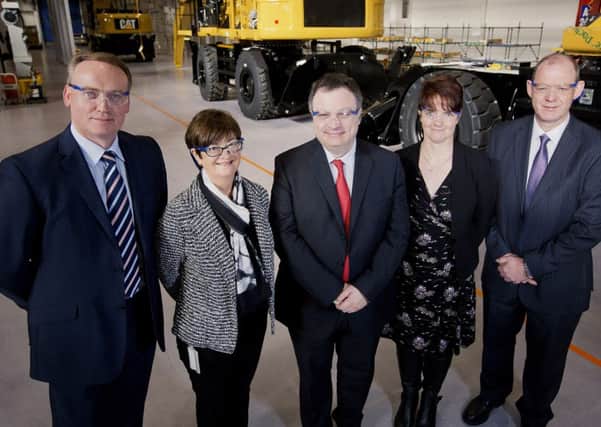 Employment and Learning Minister Dr Stephen Farry visited Caterpillar (NI) in Larne to tour the facility and observe the training being provided for the companys material handling project, which has been supported by £220,000 of funding from the Department's Assured Skills Programme. Also pictured are Philip Boyd, Belfast Metropolitan College Trainer, Cathy Taylor, Caterpillar (NI) HR Manager, Maeve McKeag, DEL Assured Skills  and Robert Kennedy, Caterpillar (NI) Operations Director. INLT 42-681-CON