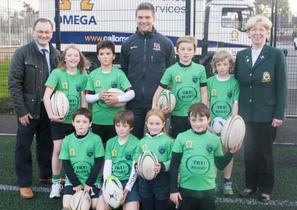 Pictured at the OLT Creggan, during the launch of the 'Try Rugby' scheme, in conjunction with COD Rugby and Ulster Rugby, left Scott Ploocok (COD Rugby Mini Coach), Michael Allen (Ulster Rugby) and Susan Spence (COD Rugby President) along with some children enjoying the games. (DER-42-1710-GMI-02-RUGBY)
