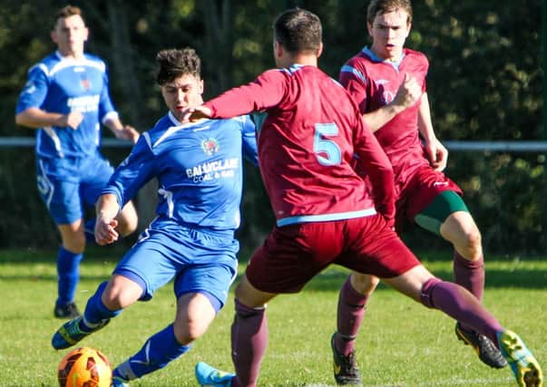 Division 1C: Mossley's Lee Garrett on the attack during his side's 3-1 win over 18th Newtownabbey last weekend.