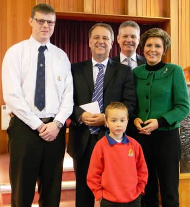Pastors Jonathan and Yvonne Payne pictured with Captain Mark Boreland and Noah McMullan, 3rd  Ballymoney Boys' Brigade, presenting  Richard Gunning (Reach the Unreached Ministries) with a cheque for £435 for Kenya. INBM43-14 SS