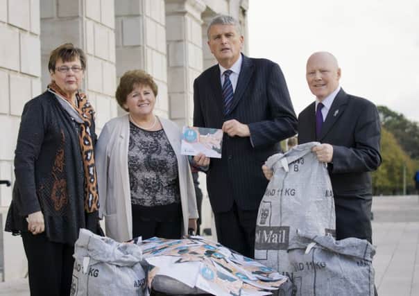 (Cancer patients Vera Saunderson (left)and Allister Murphy (right), along with Rosin Foster, Cancer Focus NI chief executive, present a petition of more than 24,000 names to Health Minister Jim Wells  (picture by Brian Morrison). INCT 41-799-CON