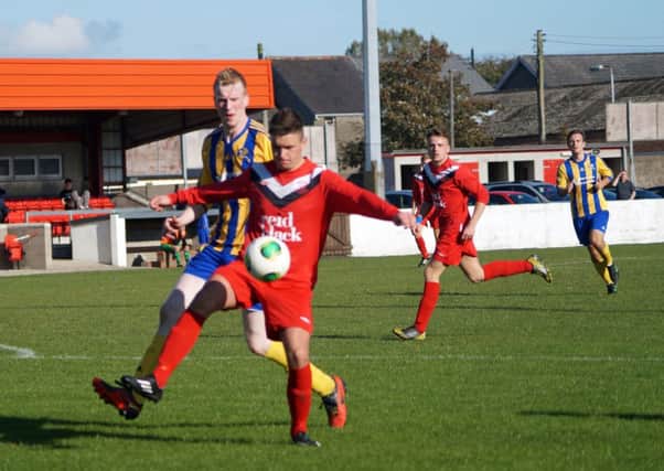 Action from Ballyclare Comrades Reserves' 6-0 win over Woodlands last weekend.