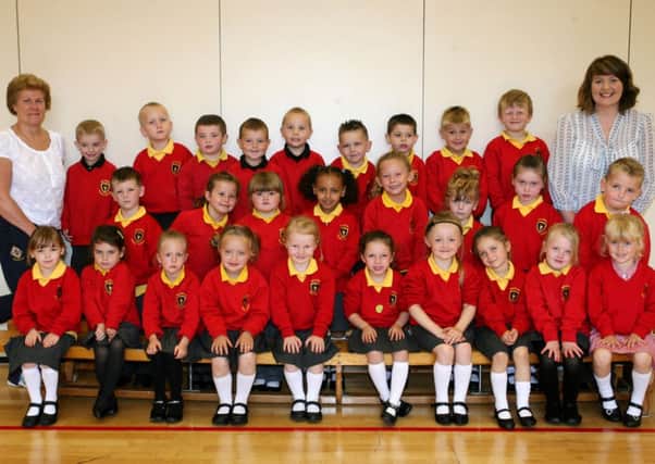 Primary 1 pupils from Ballykeel PS pictured with their teacher Mrs. K. McGlaughlin and classroom assistant Mrs. E. Ewart. INBT40-729AC