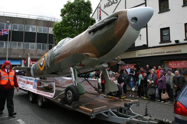 The replica Spitfire made its public debut in Lisburn, at the Mayors Parade in May. The wings are transported separately from the fuselage, in order to avoid knocking people off the footpaths.