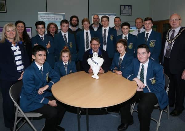 Slemish College Year 11 Technology students who visited Michelin Ballymena last week as part of the ?? Manufacturing project. Included is Michelin Ballymena plant manager John Milstead. INBT 43-102JC