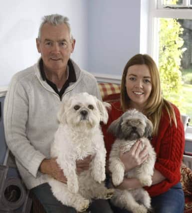 Paul Mulholland and his daughter Sarah McIntyre with Dogs Stella 1 and Lizzie 3 who sented out four baby hedgehogs in their Clare Road Home Garden in Ballycastle. INBM43-14S