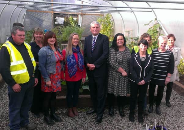 Jim Wells with members of the STEPS mental health group during a tour of the Polytunnel in Draperstown.