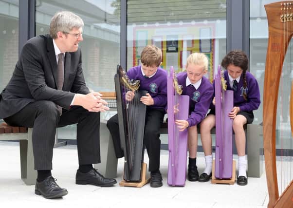 ©/Lorcan Doherty Photography -18th June 2014

Minister visits Gaelscoil Neachtain, Dungiven

Education Minister John O'Dowd enjoys a harp performance by Gaelscoil Neachtain pupils Cain McCloskey, Aisling Nic Giollagain and Aoife Nig Uiginn during his visit to the school's new premises.

Photo Lorcan Doherty Photography