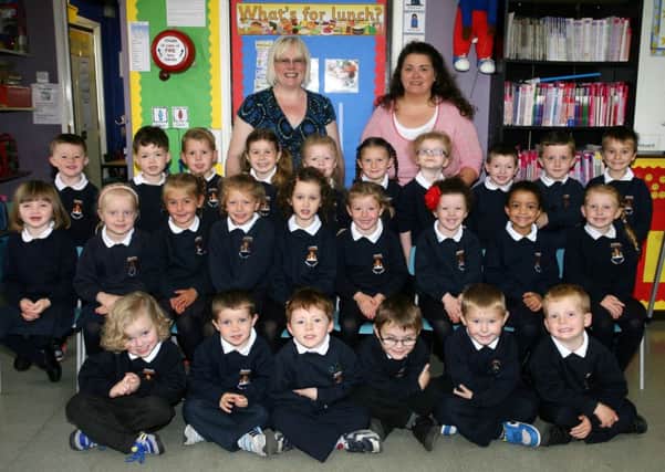 Happy smiles from the P1 class at Braidside Integrated PS along with teacher Mrs. Sonia Martin and classroom assistant Caroline Millar. INBT40-764AC