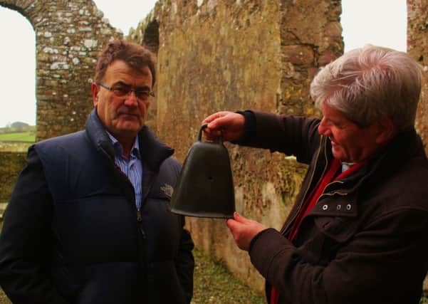 Sean Beattie shows Joe Mahon the 10th century Boden's Bell.