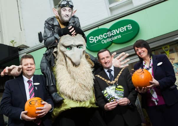 Mayor of Coleraine, Councillor George Duddy with Stephen Ball, Customer Service Manager and Alison McAuley, Optical Assistant, Specsavers Coleraine, sponsors of the Coleraine Halloween event and Zak with the friendly ogre Momo, by artist Paul Quate.