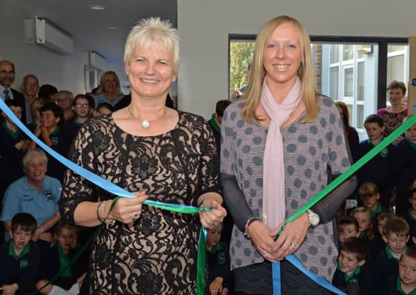Tildarg Primary School past principal, Mrs Lynda Mitchell (left) and current school principal, Mrs Dickson untie the ribbons to officially open the new extension at the school. INNT 40-001-PSB