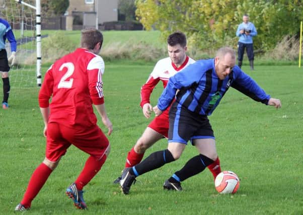 A Waveney Swifts player bursts clear of a Newpark Olympic challenge.