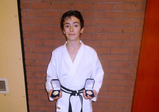 Seven Towers Karate Club member Isaac Berrisford with his two NI Champion Gold Medals.