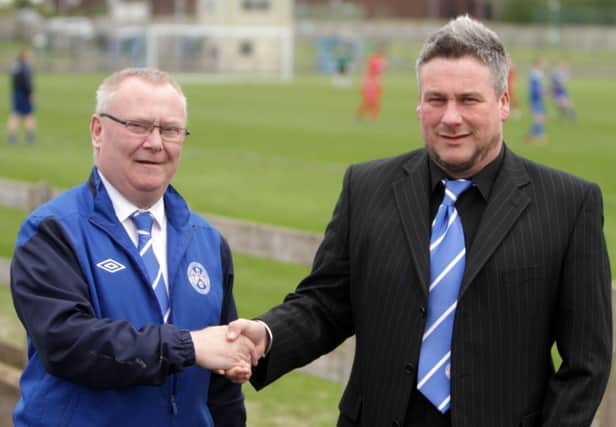 PROUD AS A......Ballymoney Utd Chairman, Noel Lamont welcomes new team boss Chris Peacock on board during Saturday's game against Annagh at the Riada Stadium.INBM19A-14 034SC.
