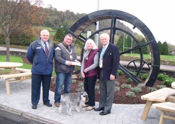 Glynn resident Jean Hood with her dog Jack, receiving her £50 voucher for 'Doing the Right Thing'. Also pictured are Gawn Graham, Environmental Warden for Larne Borough Council, Mayor of Larne Councillor Martin Wilson, and John Shannon, chairman of Larne Traders Forum.  INLT 43-680-CON