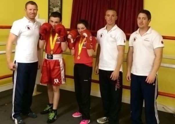 Jude Lagan and Chloe Tracey who claimed Nine County championships recent for Mark Heagney ABC. They are pictured with coaches Romauld Heagney, Dessie Tracey and Richard Toner.