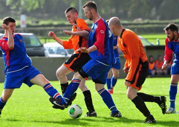 Coagh Utd Reserves block out a Connor attack during Saturday's Irish Junior Cup clash at Coagh Sports Centre.INMM4314-380