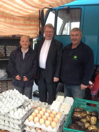 During a visit to Carrickfergus, the Presbyterian Moderator Rev Dr Michael Barry called into to the market at Joymount where he met Norman Laird and Billy Hill. INCT 42-750-CON