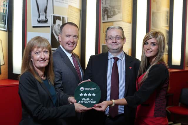 Howard Hastings, NITB Chairman presents Ailish Forde (Public Affairs and Communications Director), Frank ODonnell (Managing Director), and Sarah Smith (Visitor Experience Co-ordinator) from Coca Cola with their four-star plaque