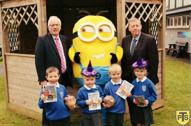 Pupils from Tonagh Primary School, (from left) Liam Hewitt, Kayla Gallagher-Courtney, Stuart Shaw and Lucy Redfern pictured with Alderman Allan Ewart and Alderman Paul Porter at the launch of Lisburn's Purple Turnip Festival. INLT 43-690-CON