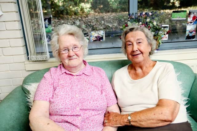 From left, Mary Heery and Vera Kidd who attend the Age NI day centre in Anna House, Dunmurry are keen for more volunteers.