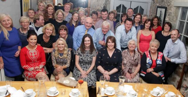 IS THERE A DOCTOR IN THE HOUSE! Pictured along with Dr Brian Lynch at the Tartine Restaurant Distillers Arms on Saturday night to mark his retirement, are family, colleagues, (past and present) Centre staff and friends, who made it an occasion to remember.INBM42-14 049SC.