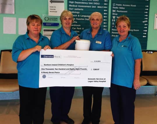 Maureen Ward, Anthea Presho, Sylvia Jess and Audrey Belshaw present a cheque for £1288.97 to Jenay Doyle from NI Childrens Hospice. Thie money was raised through a coffee morning held in Lagan Valley Hospital in September.