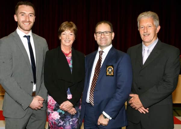 Mrs. C. Magee, principal of St. Patrick's College, with special guests Mr. Peter McNicholl, Mr. Arthur O'Brien and Mr. Derek Beattie, at the schools annual prize day. INBT43-218AC